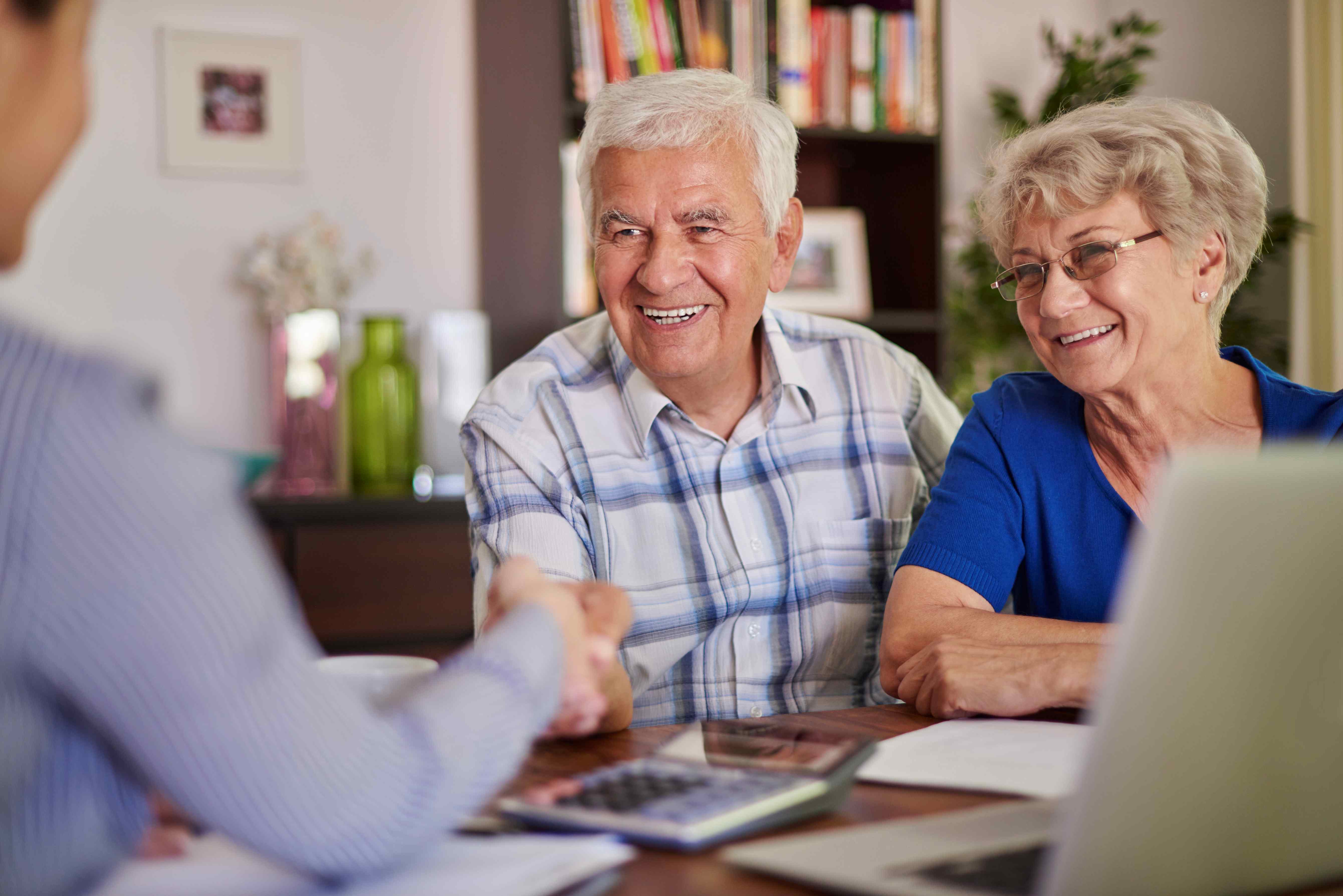 Senior couple discussing strategic donation plans to support global education