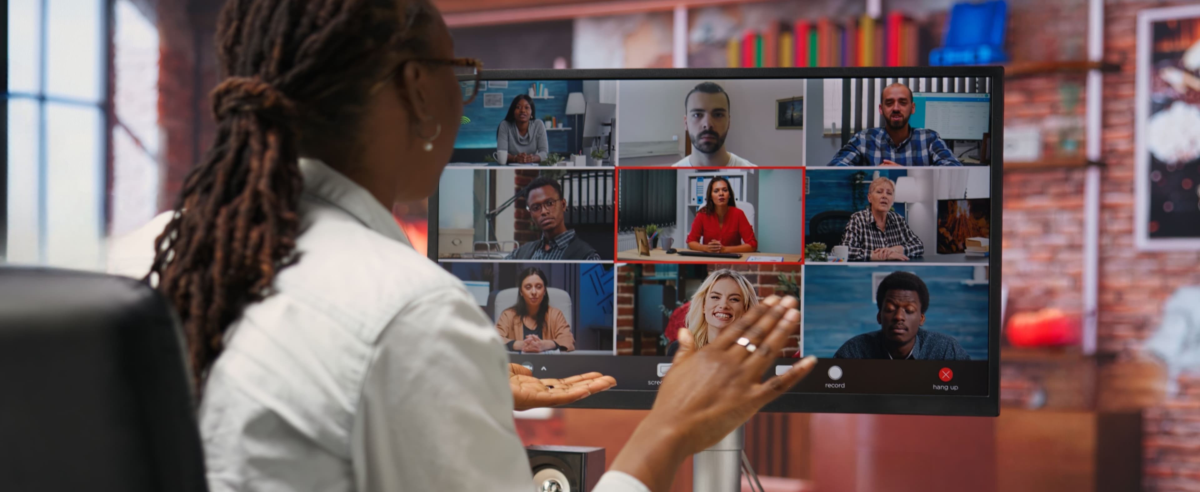 Mentor greeting trainees videocall from home desk